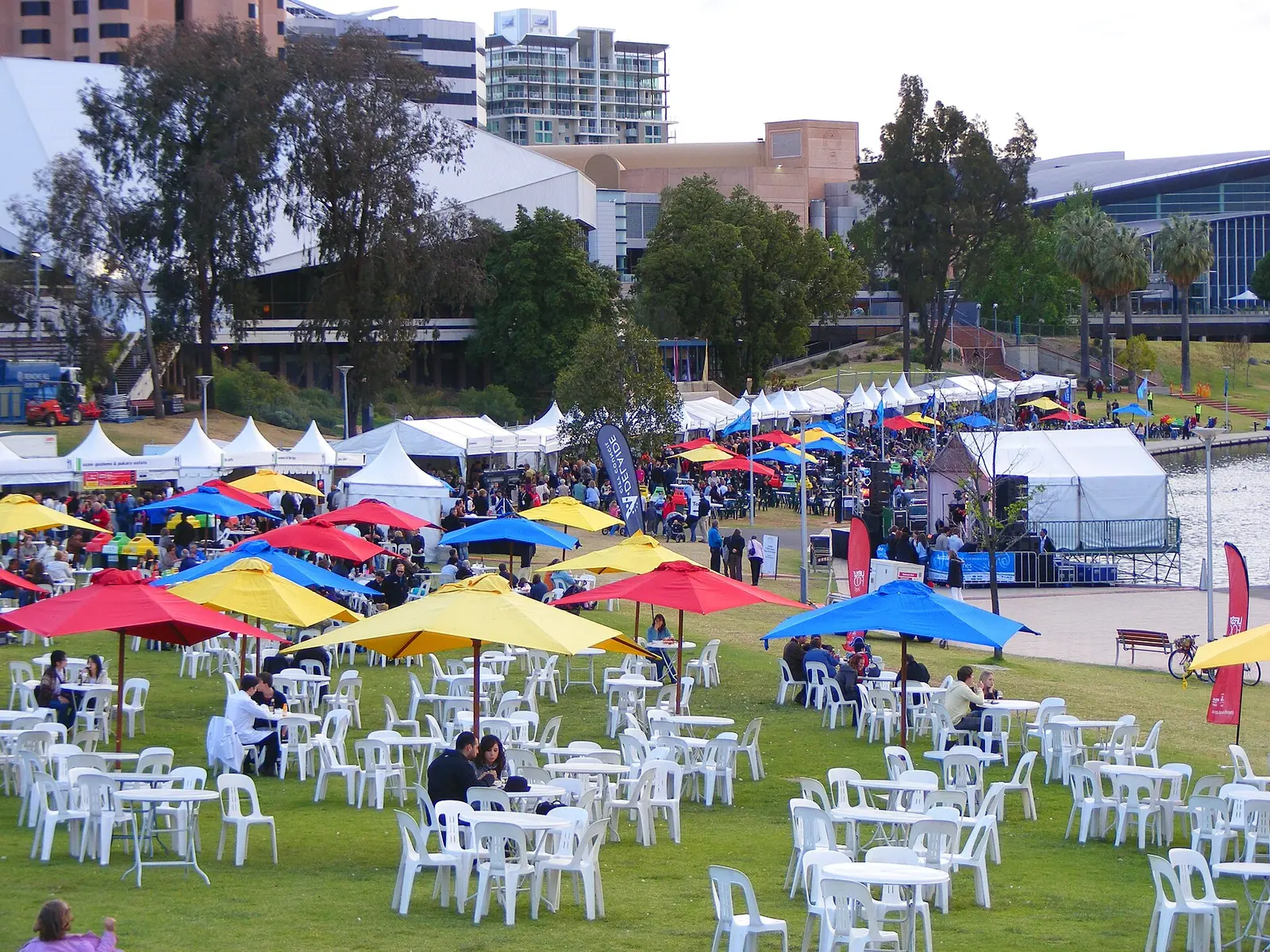 Coloured umbrellas and tables on the lawn at Elder Park during Tasting Australia, Adelaide